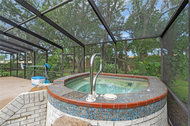 8470 Cranes Roost Dr, New Port Richey, FL 34654 - view of pool featuring an in-ground hot tub and glass enclosure