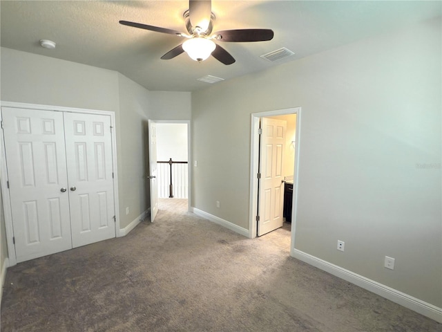 7508 Sea Lilly Ct, Apollo Beach, FL 33572 - unfurnished bedroom with carpet floors, a closet, ceiling fan, and ensuite bath