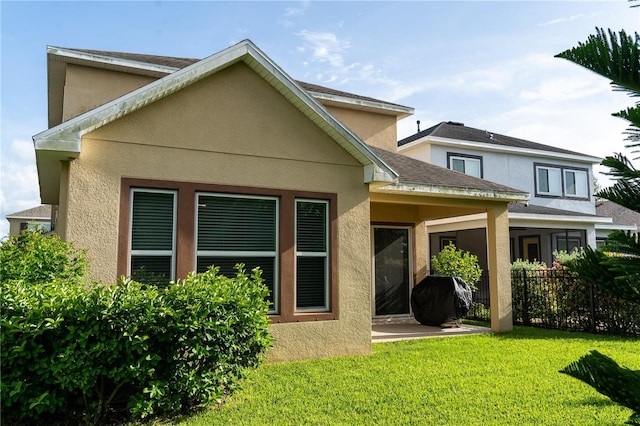 7508 Sea Lilly Ct, Apollo Beach, FL 33572 - back of house with stucco siding and a patio