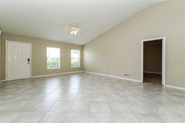13190 Drysdale St, Spring Hill, FL 34609 - empty room featuring a ceiling fan, high vaulted ceiling, and light tile patterned flooring