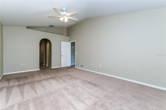 13190 Drysdale St, Spring Hill, FL 34609 - carpeted empty room featuring arched walkways, ceiling fan, and high vaulted ceiling
