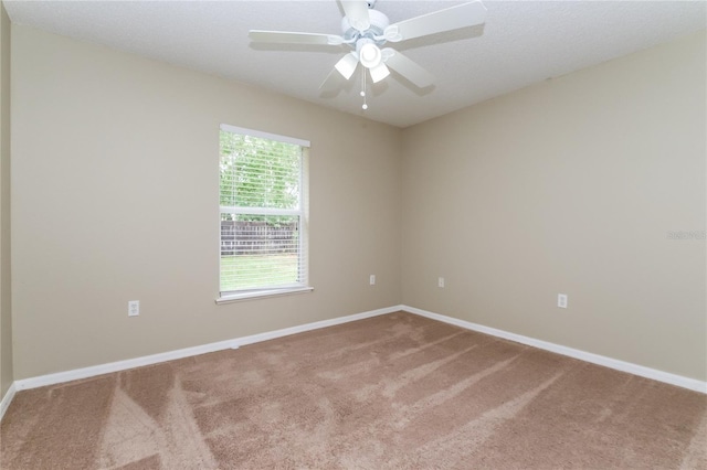 13190 Drysdale St, Spring Hill, FL 34609 - carpeted spare room with baseboards and ceiling fan