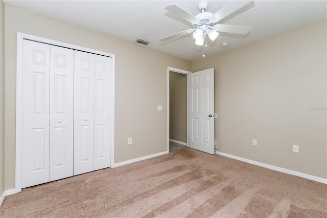 13190 Drysdale St, Spring Hill, FL 34609 - unfurnished bedroom with carpet flooring, a closet, and a ceiling fan