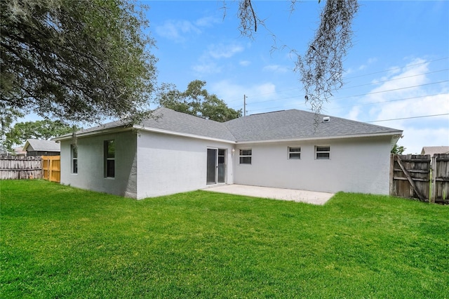 13190 Drysdale St, Spring Hill, FL 34609 - rear view of house with a patio area, stucco siding, and roof with shingles