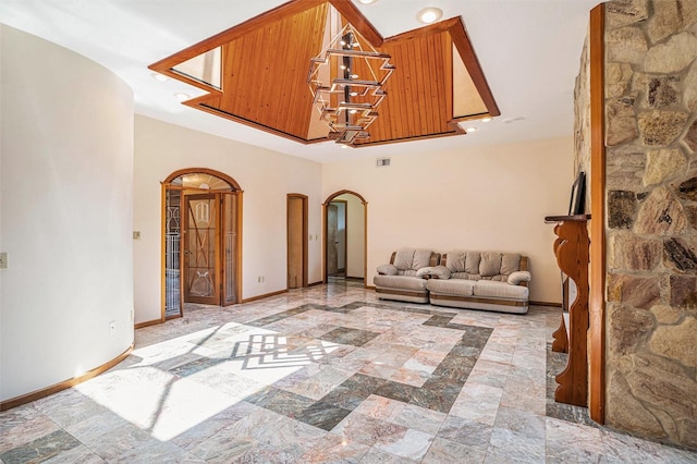 7715 Riverview Dr, Riverview, FL 33578 - living area with arched walkways, recessed lighting, and a chandelier