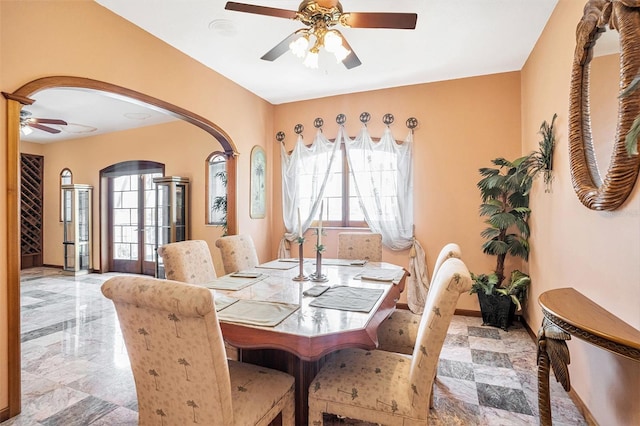7715 Riverview Dr, Riverview, FL 33578 - dining space with ceiling fan and arched walkways