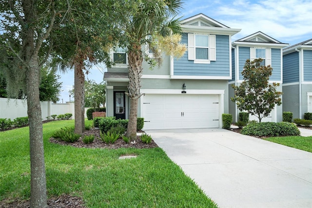 2101 Sunset Wind Loop, Oldsmar, FL 34677 - view of front of property featuring driveway, stucco siding, and an attached garage