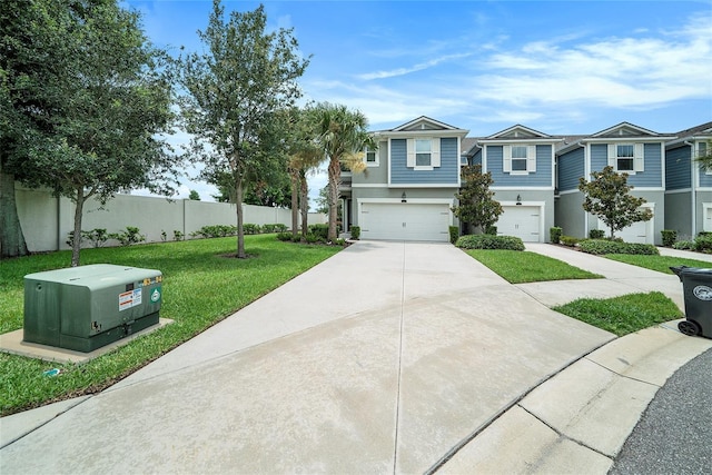 2101 Sunset Wind Loop, Oldsmar, FL 34677 - view of front facade with a garage, driveway, stucco siding, and a residential view