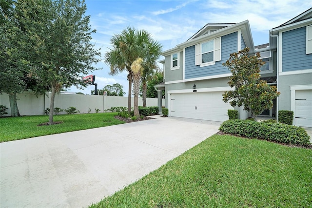 2101 Sunset Wind Loop, Oldsmar, FL 34677 - view of front of home featuring a garage, concrete driveway, and stucco siding