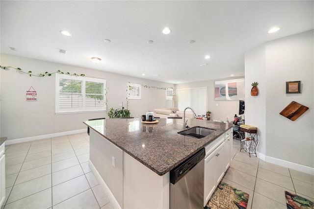 2101 Sunset Wind Loop, Oldsmar, FL 34677 - kitchen featuring dishwasher, a kitchen island with sink, light tile patterned floors, recessed lighting, and dark stone counters