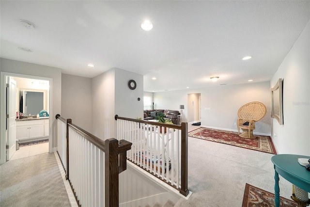 2101 Sunset Wind Loop, Oldsmar, FL 34677 - hall featuring an upstairs landing, light colored carpet, and recessed lighting