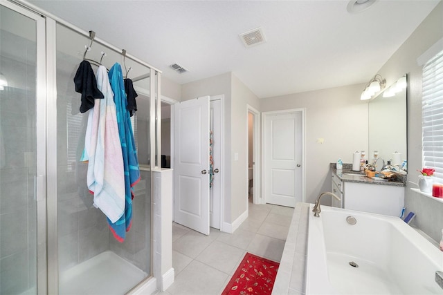 2101 Sunset Wind Loop, Oldsmar, FL 34677 - full bath with a shower stall, vanity, a garden tub, and tile patterned flooring