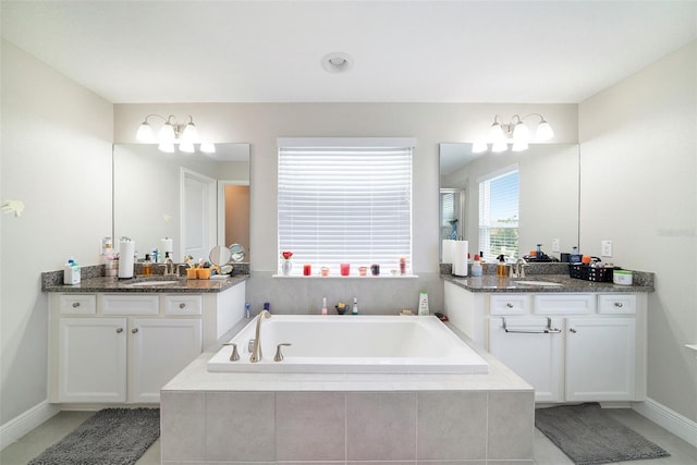 2101 Sunset Wind Loop, Oldsmar, FL 34677 - bathroom with a garden tub, tile patterned floors, two vanities, and a shower