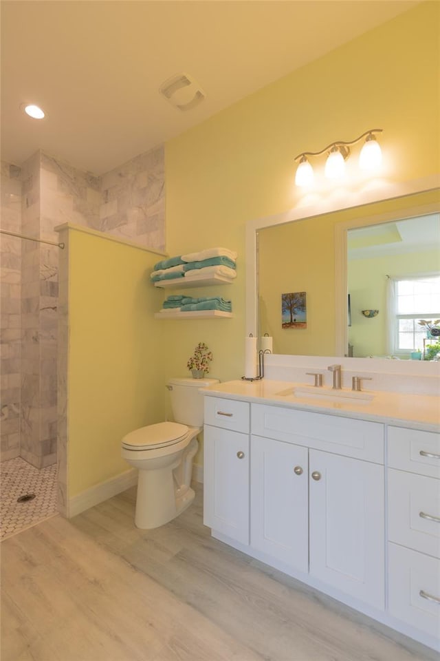 9016 Falcon Ct, Venice, FL 34293 - full bathroom with vanity, walk in shower, wood finished floors, and recessed lighting