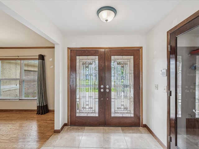 5110 Lake Valencia Blvd E, Palm Harbor, FL 34684 - entrance foyer featuring french doors and baseboards