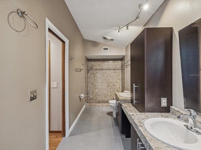 5110 Lake Valencia Blvd E, Palm Harbor, FL 34684 - full bathroom featuring vanity, lofted ceiling, and tiled shower