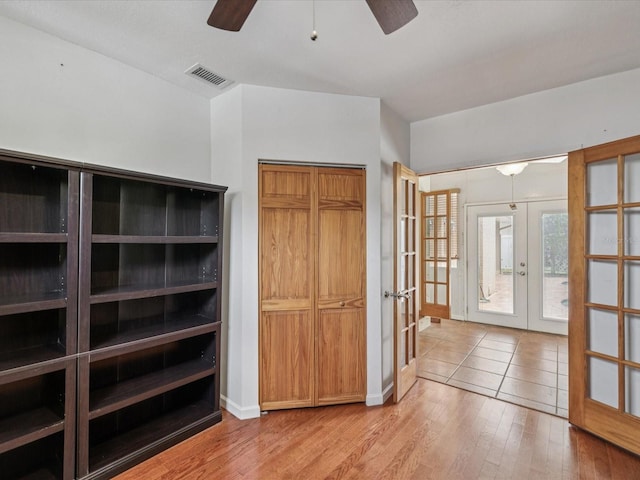 5110 Lake Valencia Blvd E, Palm Harbor, FL 34684 - foyer entrance with french doors, ceiling fan, and wood finished floors