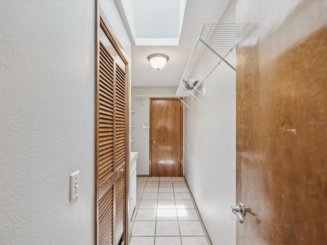5110 Lake Valencia Blvd E, Palm Harbor, FL 34684 - hall with light tile patterned flooring