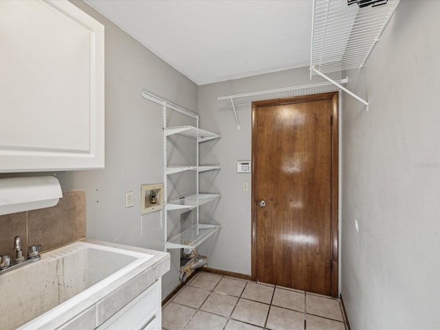 5110 Lake Valencia Blvd E, Palm Harbor, FL 34684 - laundry room featuring light tile patterned floors and washer hookup