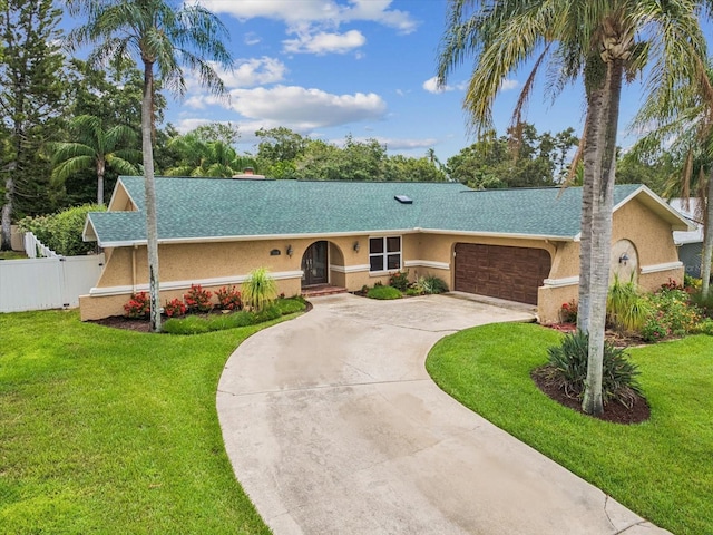 5110 Lake Valencia Blvd E, Palm Harbor, FL 34684 - ranch-style house featuring a garage, driveway, stucco siding, and a shingled roof