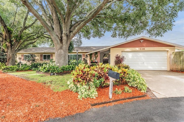 1328 Glenview Ln, Lakeland, FL 33813 - ranch-style home with a garage and driveway