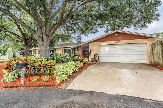 1328 Glenview Ln, Lakeland, FL 33813 - ranch-style home with a garage and concrete driveway