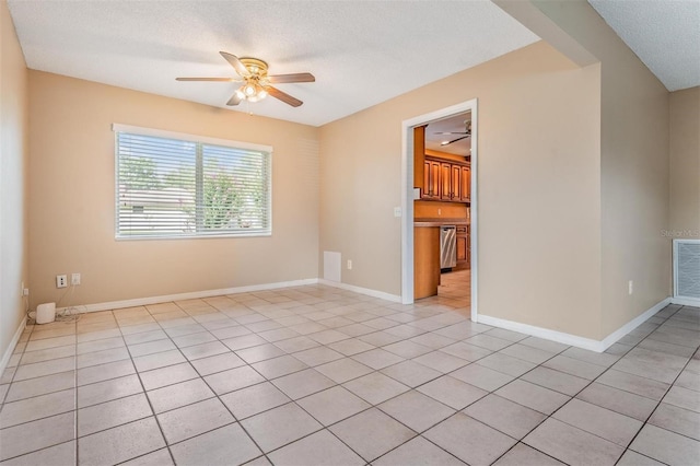 1328 Glenview Ln, Lakeland, FL 33813 - unfurnished room with ceiling fan, light tile patterned floors, and a textured ceiling