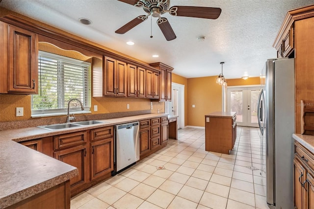 1328 Glenview Ln, Lakeland, FL 33813 - kitchen featuring appliances with stainless steel finishes, brown cabinets, and recessed lighting