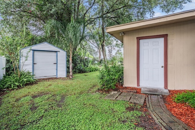 1328 Glenview Ln, Lakeland, FL 33813 - view of green lawn featuring a storage unit