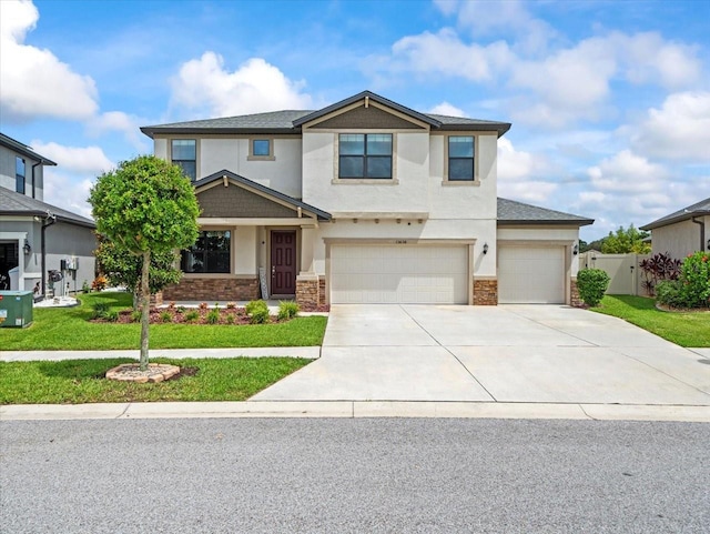 13638 Moosehead Cir, Hudson, FL 34669 - view of front of property featuring stone siding, stucco siding, driveway, and a garage