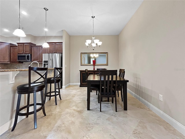 2802 Devonoak Blvd, Land O Lakes, FL 34638 - dining space featuring baseboards and a chandelier