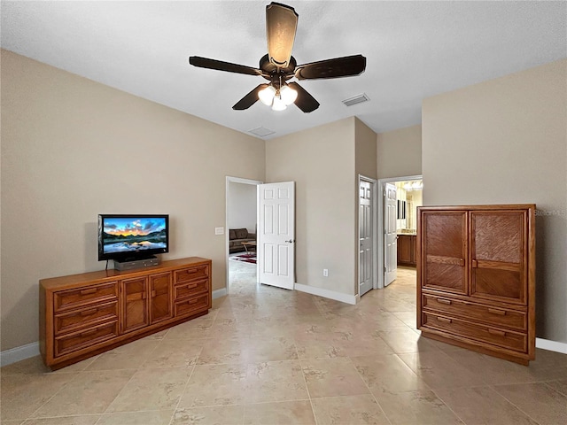 2802 Devonoak Blvd, Land O Lakes, FL 34638 - bedroom featuring ensuite bath, a ceiling fan, and light tile patterned flooring