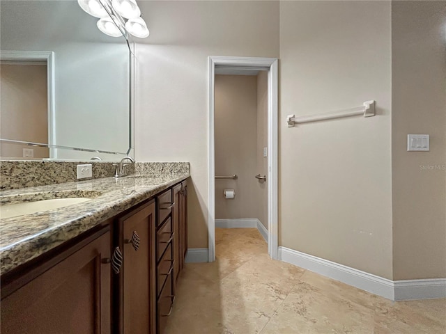 2802 Devonoak Blvd, Land O Lakes, FL 34638 - full bathroom featuring double vanity and baseboards