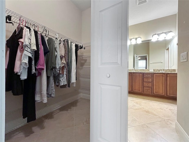 2802 Devonoak Blvd, Land O Lakes, FL 34638 - spacious closet with light tile patterned floors and a sink