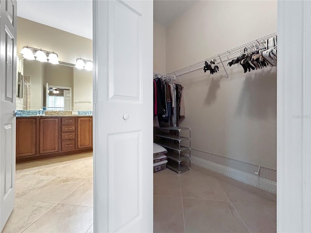 2802 Devonoak Blvd, Land O Lakes, FL 34638 - walk in closet featuring light tile patterned flooring and a sink