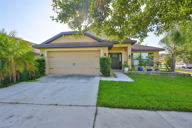 12218 Avondale Oak Pl, Riverview, FL 33578 - view of front of home featuring stucco siding, driveway, a front yard, and an attached garage