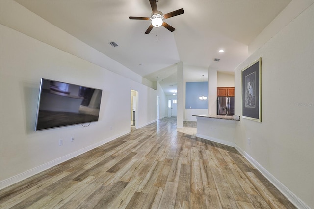 12218 Avondale Oak Pl, Riverview, FL 33578 - unfurnished living room featuring light wood-style floors, a ceiling fan, vaulted ceiling, and recessed lighting