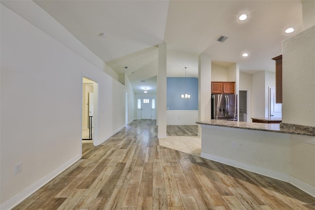 12218 Avondale Oak Pl, Riverview, FL 33578 - unfurnished living room with light wood-style floors, a chandelier, and recessed lighting