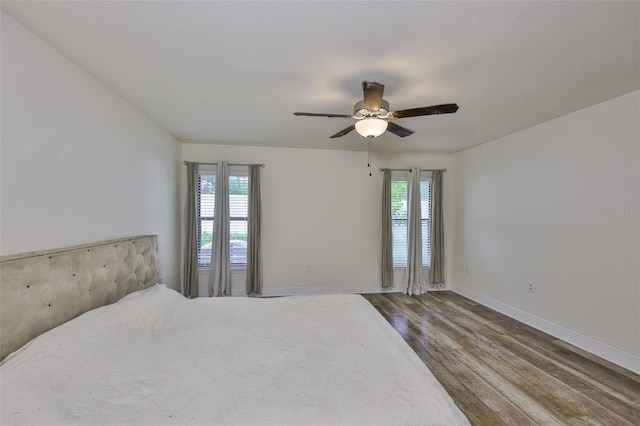 12218 Avondale Oak Pl, Riverview, FL 33578 - bedroom with wood finished floors and ceiling fan