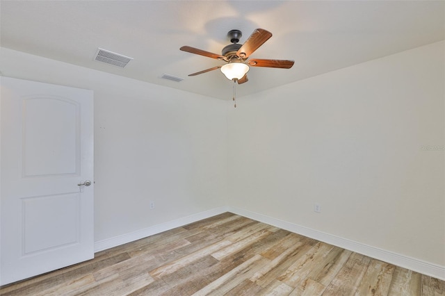 12218 Avondale Oak Pl, Riverview, FL 33578 - empty room featuring light wood finished floors and a ceiling fan