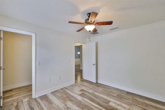 12218 Avondale Oak Pl, Riverview, FL 33578 - unfurnished bedroom with wood finished floors and ceiling fan