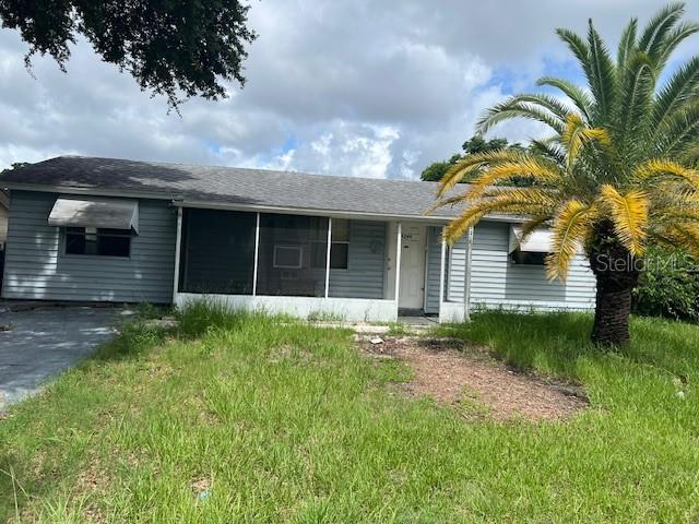 4244 Mesa Dr, New Port Richey, FL 34653 - view of front of property with a sunroom