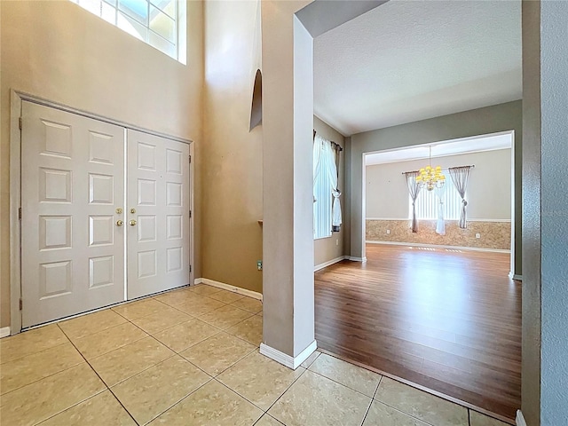 4222 Trumpworth Ct, Valrico, FL 33596 - entryway with a chandelier, light tile patterned floors, and plenty of natural light