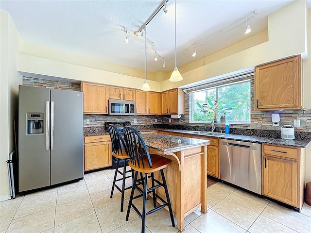 4222 Trumpworth Ct, Valrico, FL 33596 - kitchen featuring stainless steel appliances, backsplash, light tile patterned floors, hanging light fixtures, and a breakfast bar