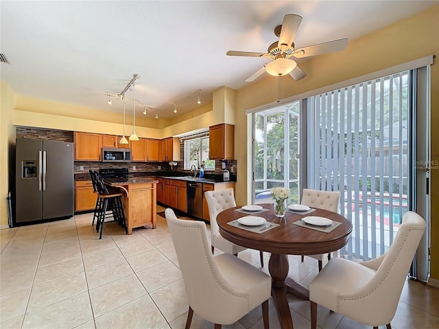 4222 Trumpworth Ct, Valrico, FL 33596 - dining area with light tile patterned floors and ceiling fan
