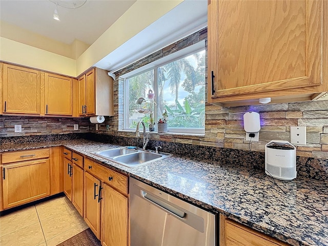 4222 Trumpworth Ct, Valrico, FL 33596 - kitchen with dishwasher, decorative backsplash, light tile patterned floors, and dark stone countertops