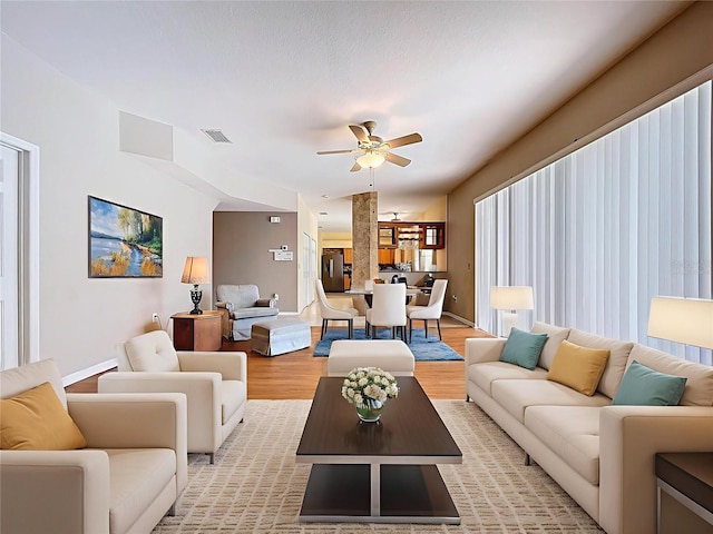 4222 Trumpworth Ct, Valrico, FL 33596 - living area with a ceiling fan and light wood-type flooring