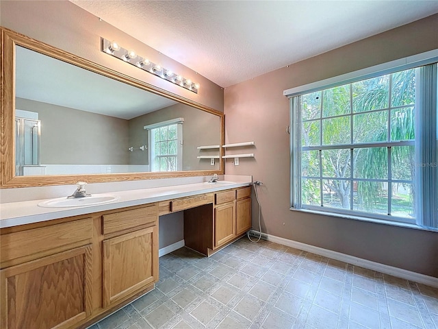 4222 Trumpworth Ct, Valrico, FL 33596 - bathroom with double vanity and a textured ceiling