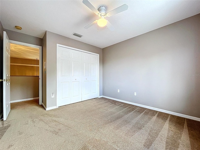 4222 Trumpworth Ct, Valrico, FL 33596 - unfurnished bedroom featuring carpet flooring, a closet, and ceiling fan
