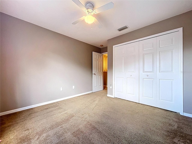 4222 Trumpworth Ct, Valrico, FL 33596 - unfurnished bedroom featuring carpet flooring, a closet, and a ceiling fan
